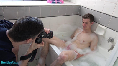Brad Hunter playing with his thick cock in the bath cover